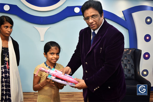 About Ten Poor and needy Students from Various Schools and Colleges of Mangalore brightened up as they received books, umbrellas and Education Scholarship from Grace Ministry on Sunday, June 16th, 2019. 